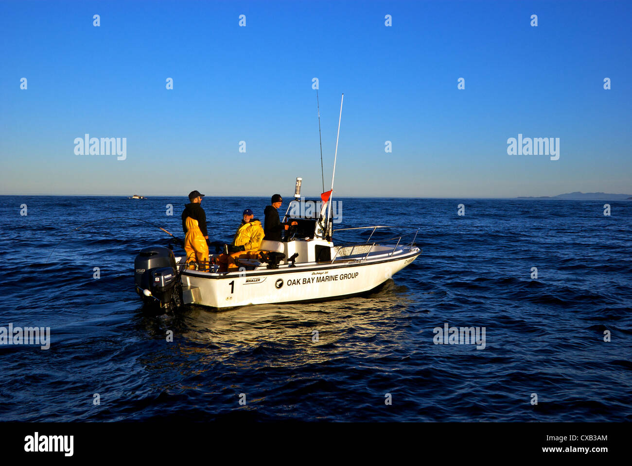 Centre console charter sport fishing boat trolling open Pacific Ocean offshore west coast Vancouver Island Ucluelet BC Stock Photo