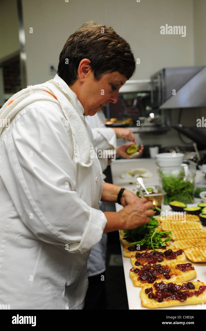 USA Indiana IN Indianapolis celebrity chef Regina Mehallick preparing panini sandwiches at her restaurant R Bistro Stock Photo