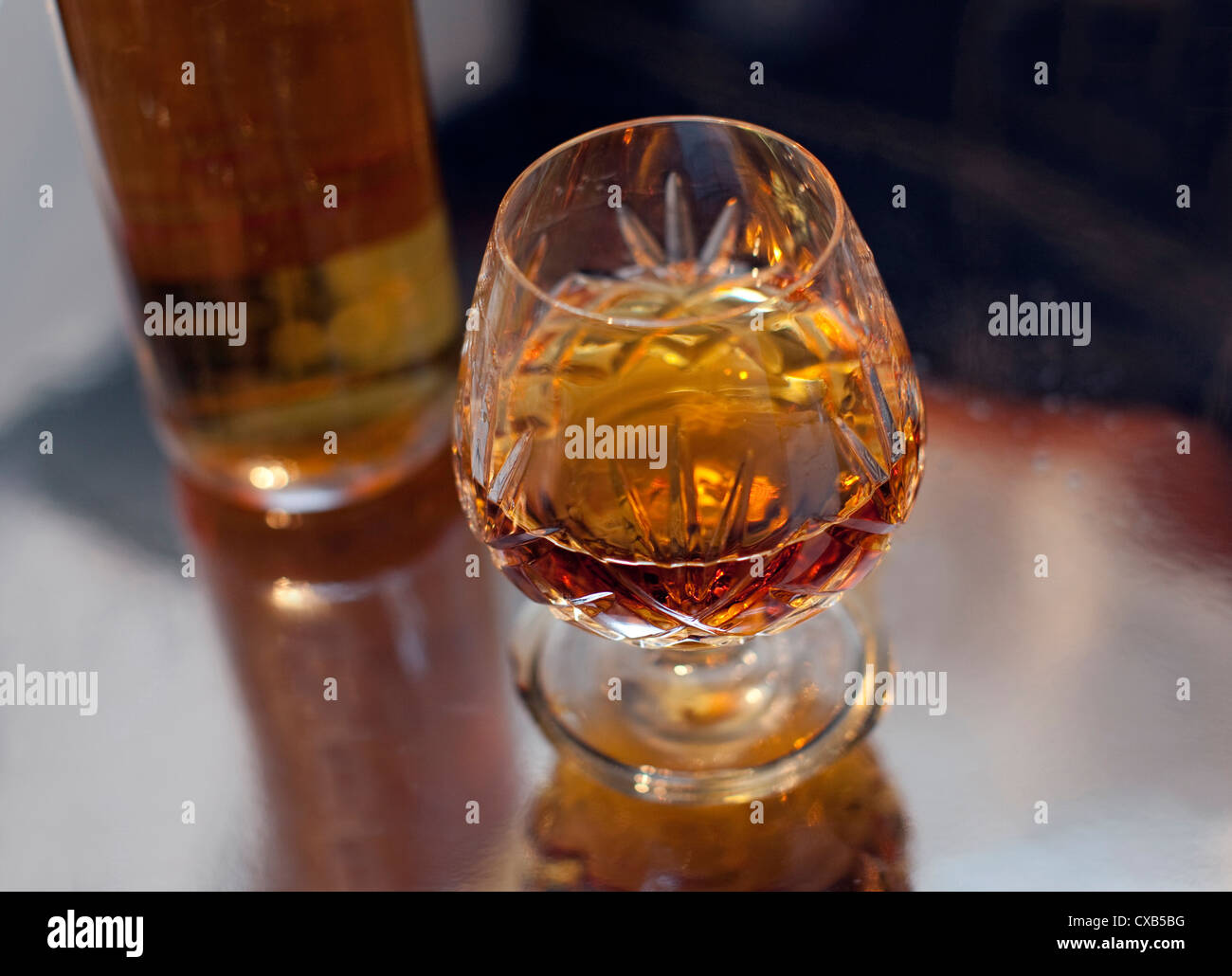Glass and bottle of brandy, London Stock Photo Alamy
