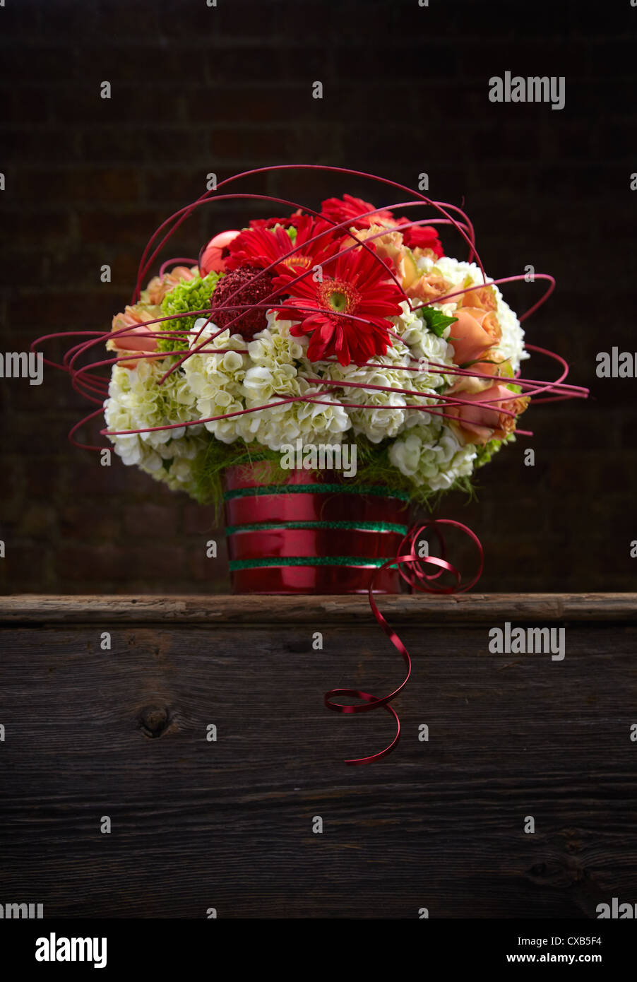 Holiday Gerbera, Hydrangea and Rose Flower Arrangement Stock Photo