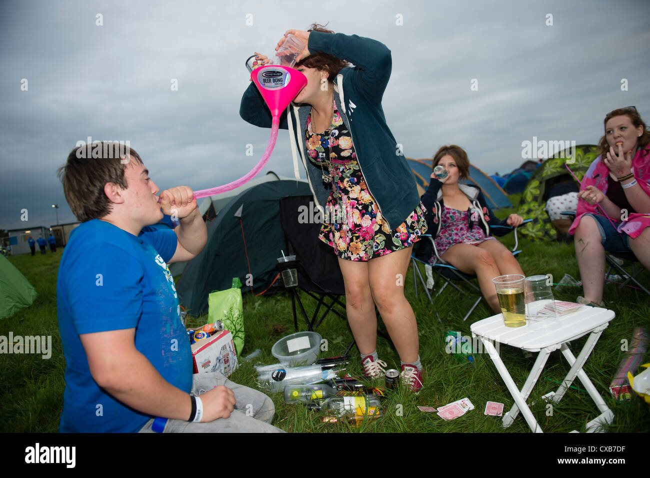 Teenagers taking part in binge drinking games on Maes B, the youth
