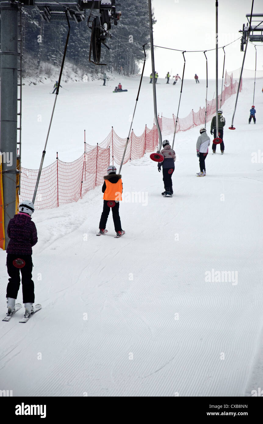 Photo of skiers on ski lift. Stock Photo