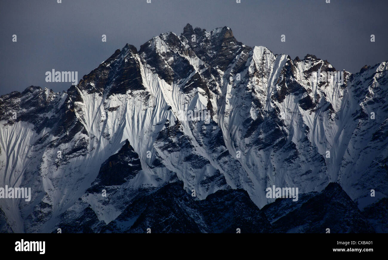 Beautiful light shining on the side of a snowcapped mountain, Langtang Valley, Nepal Stock Photo