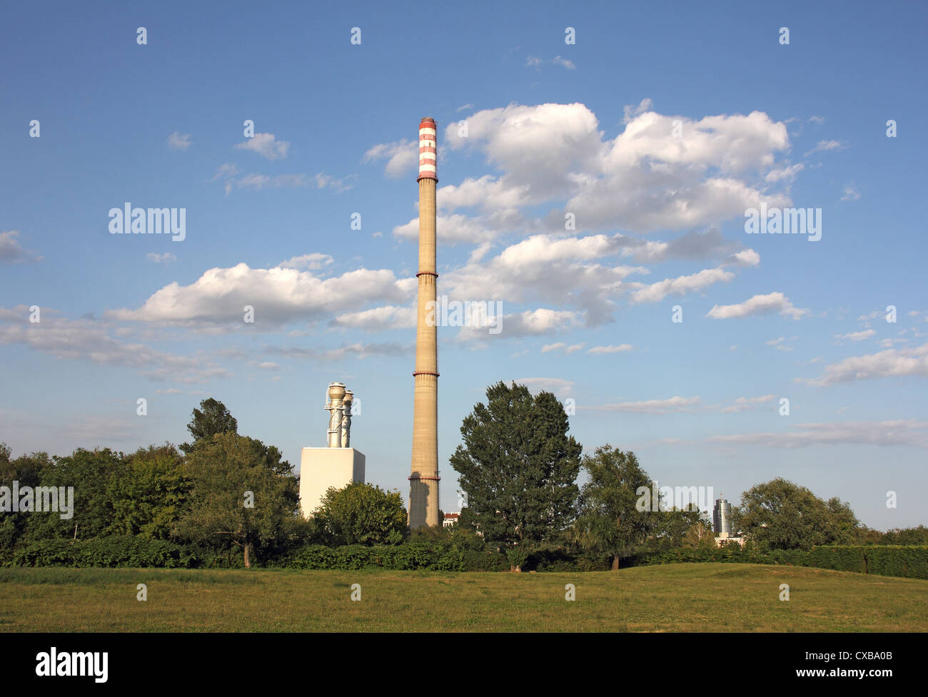 An industrial power plant with tall smoke stacks Stock Photo