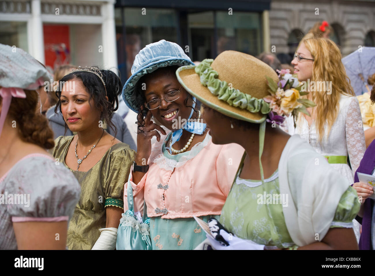 Ladies in Regency costume promenade through Bath city centre during the ...