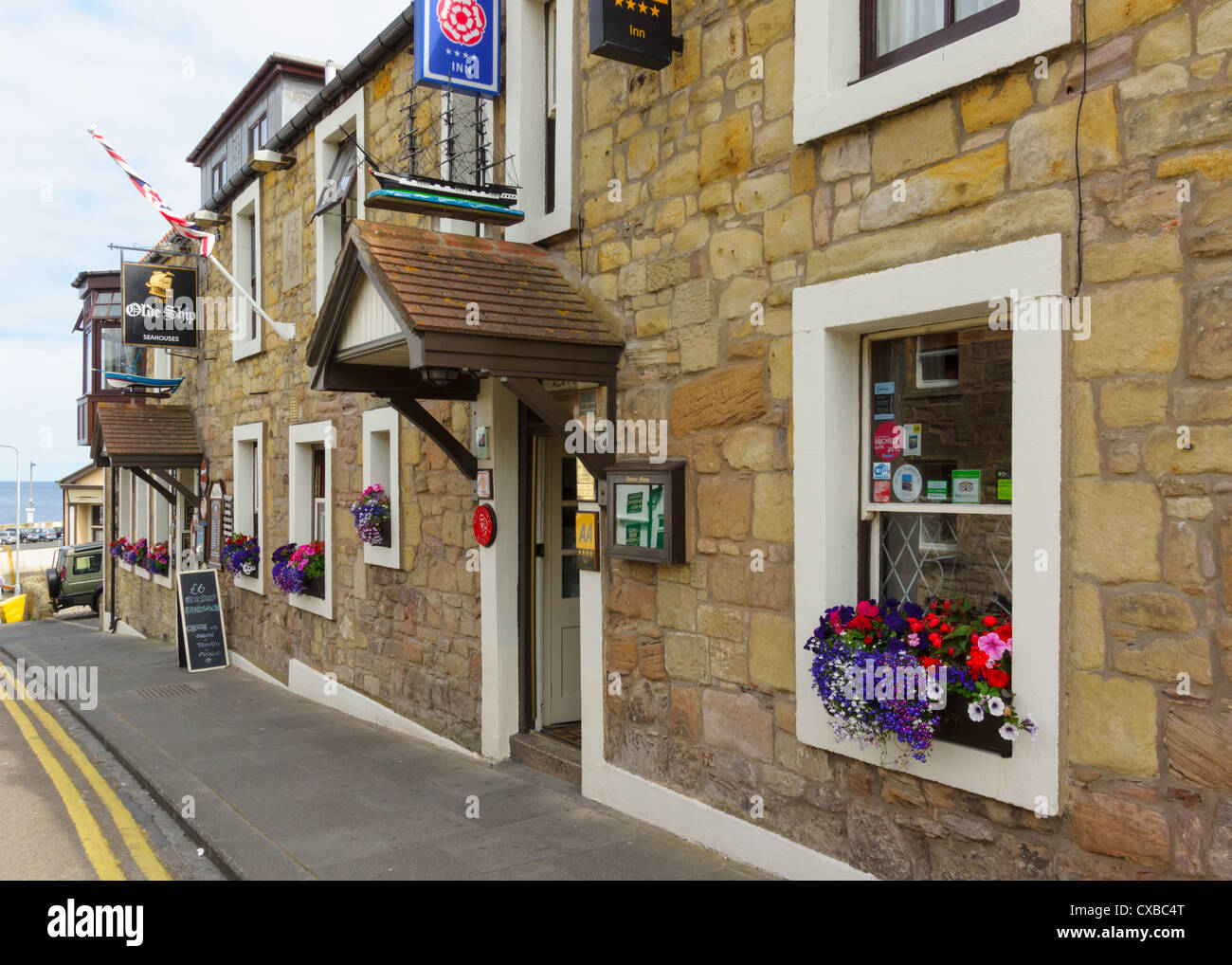 A traditional village pub in the small coastal village of Seahouses, Northumberland. Stock Photo