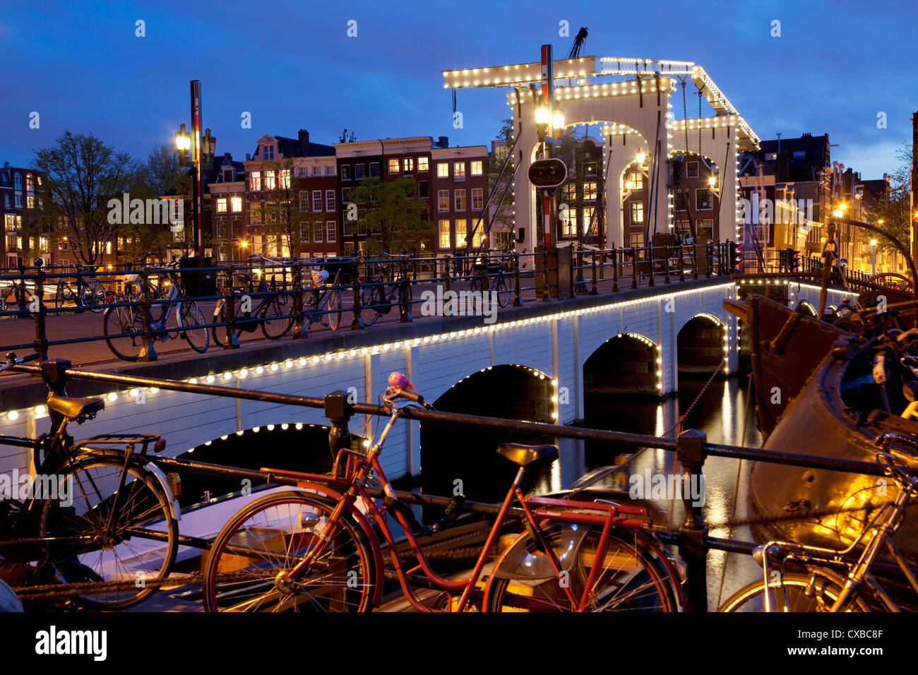 Magere Brug (Skinny Bridge) at dusk, Amsterdam, Holland, Europe Stock Photo