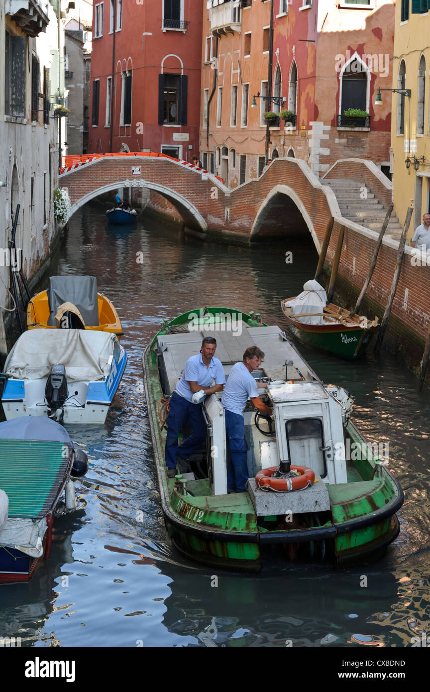 Venice garbage canal boat hi-res stock photography and images - Alamy