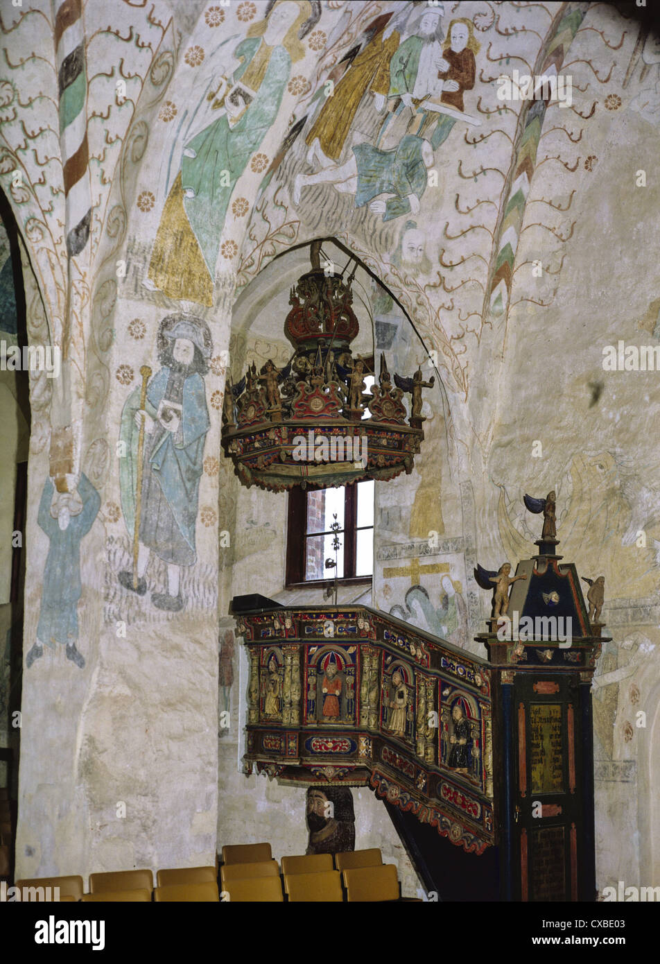 Pulpit and wall murals in the 14th century Church of the Holy Cross, Hattula, Finland Stock Photo
