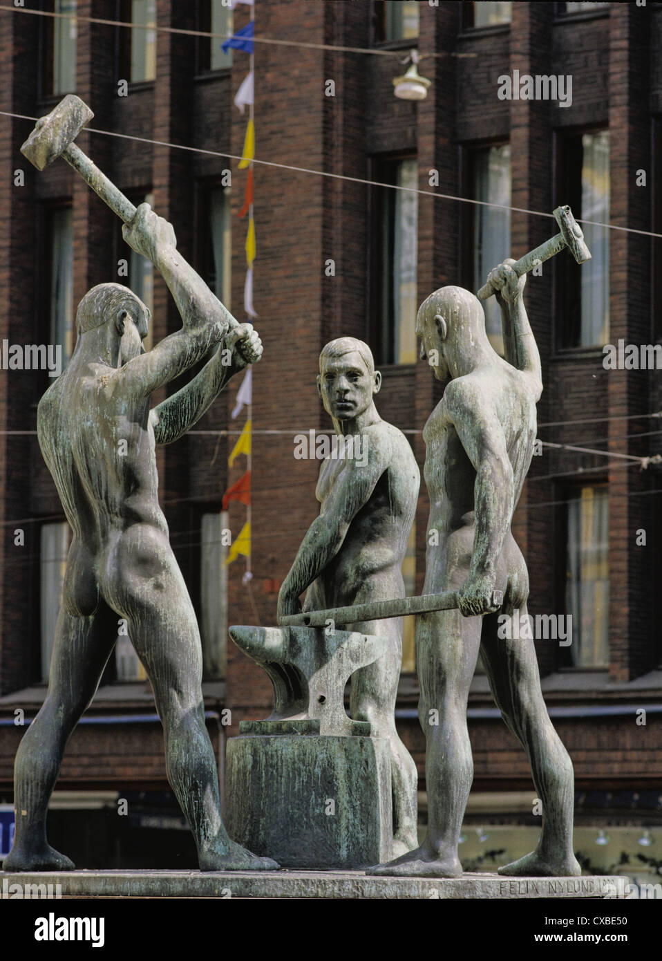 The 1932 bronze sculpture, The Three Smiths by Felix Nylund in Helsinki, Finland Stock Photo