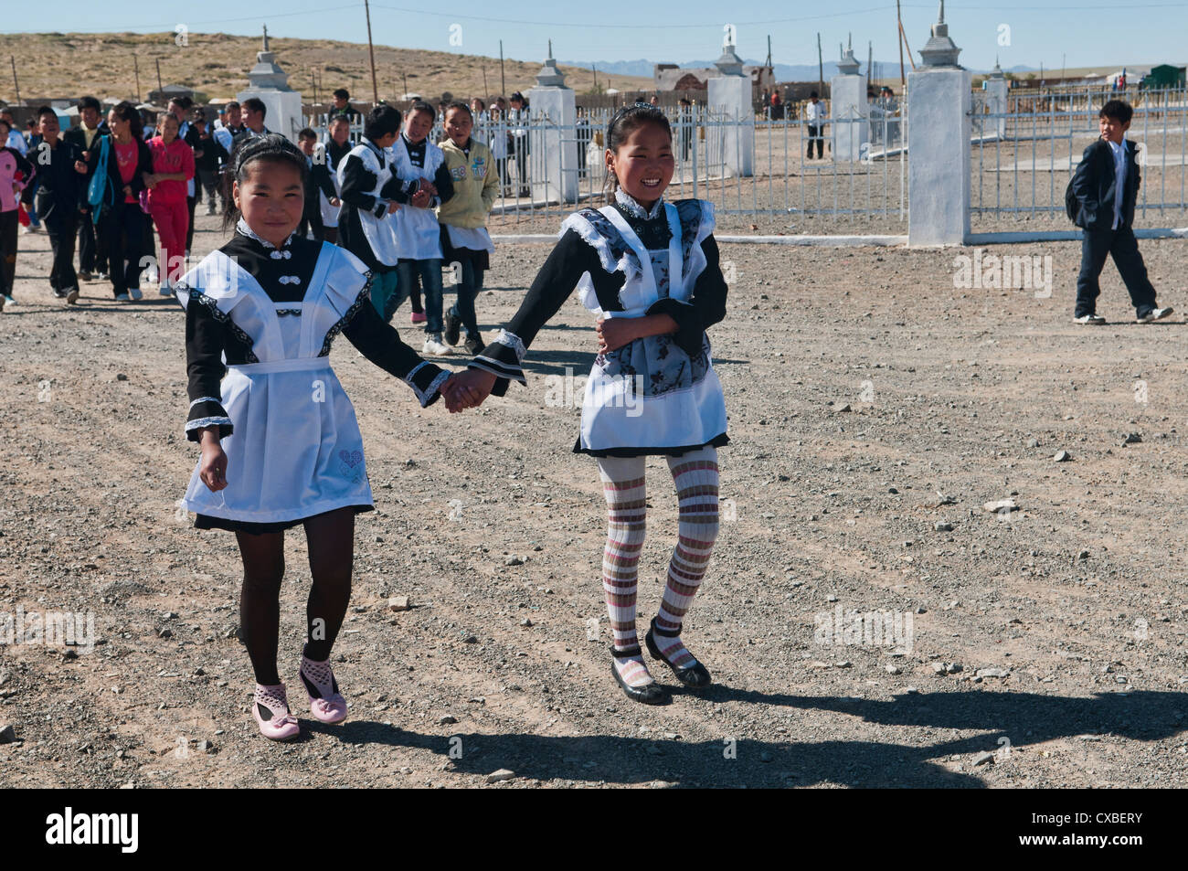 Mongolian girls in their French maid school uniforms in the Gobi Desert of Mongolia Stock Photo