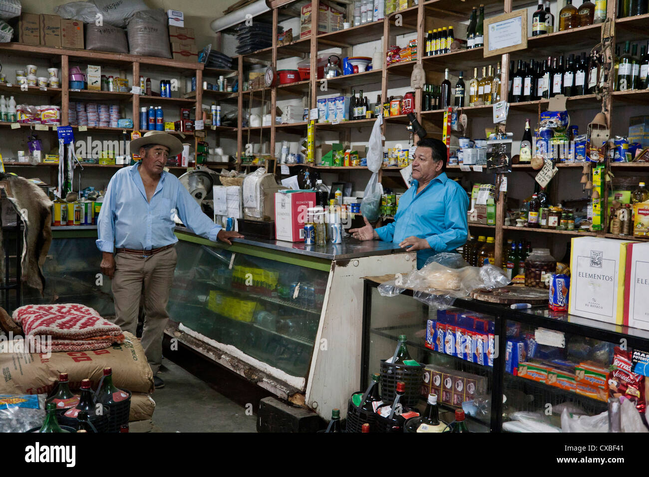 Men at a local grocery shop in Cafayate, Salta Province, Argentina. Stock Photo