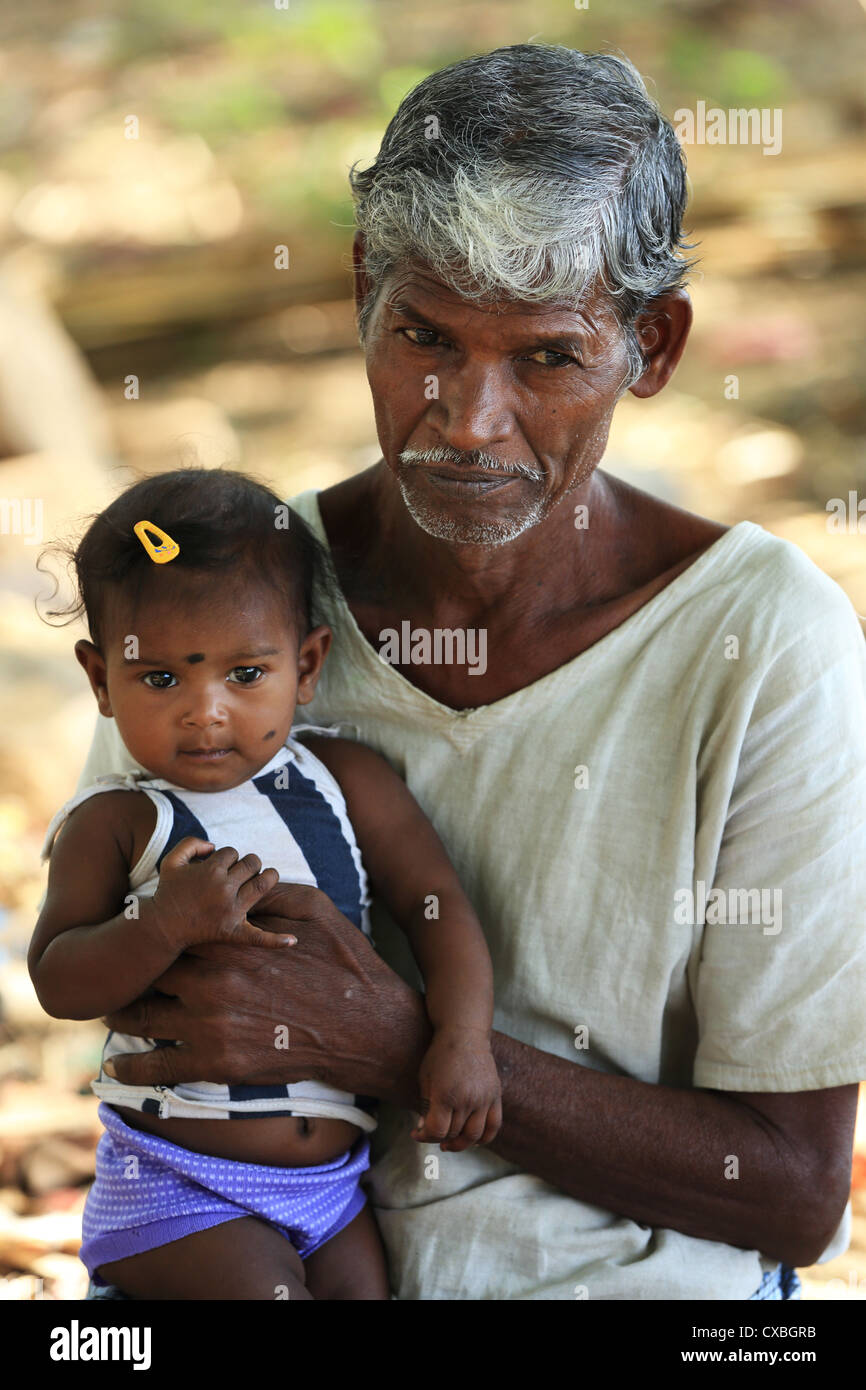 Rural old man with little girl Andhra Pradesh South India Stock Photo