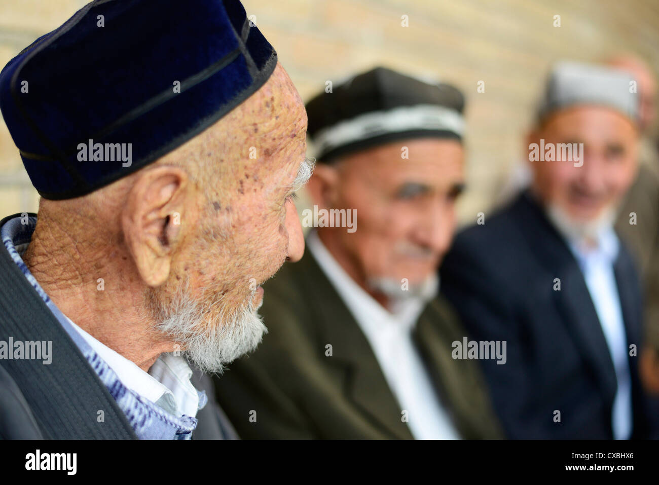 Elderly Tajik men ( from Uzbekistan) in an old neighborhood in Samarkand. Stock Photo