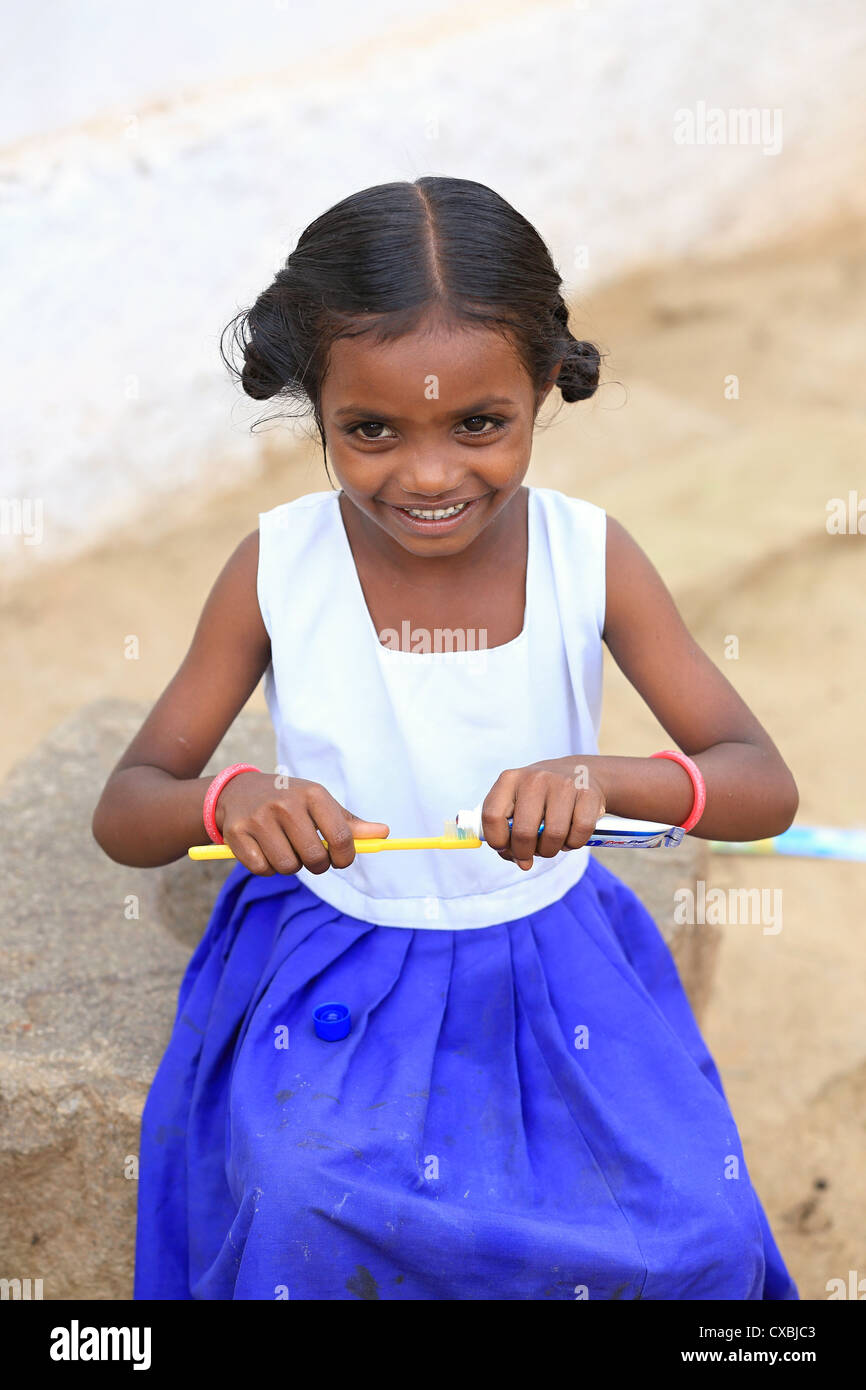 Indian school girl Dhanama with tooth brush and tooth paste Andhra Pradesh South India Stock Photo