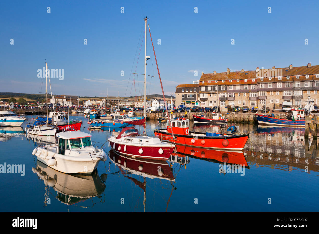 West Bay harbour with yachts and fishing boats, Bridport, gateway town for the Jurassic Coast, Dorset Stock Photo