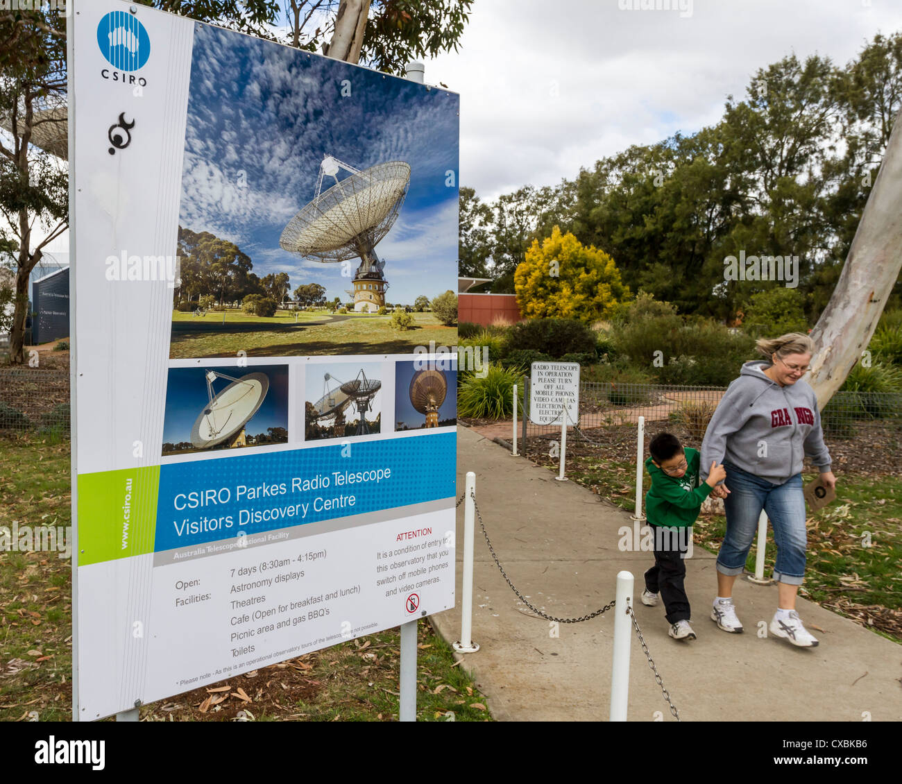 Woman and child leaving visitors centre at Parkes Radio Telescope, Parkes, NSW Australia Stock Photo