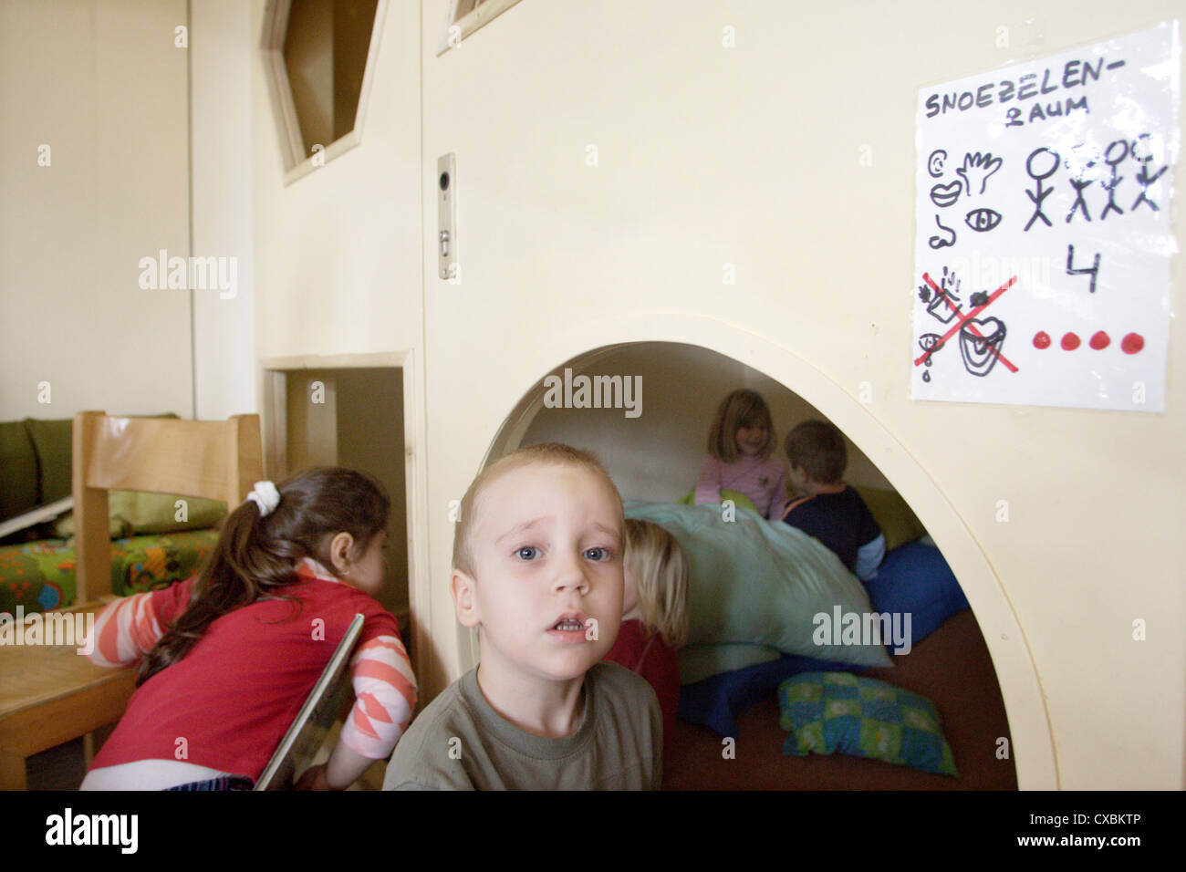 Berlin children in a daycare center look for a place to sleep Stock Photo