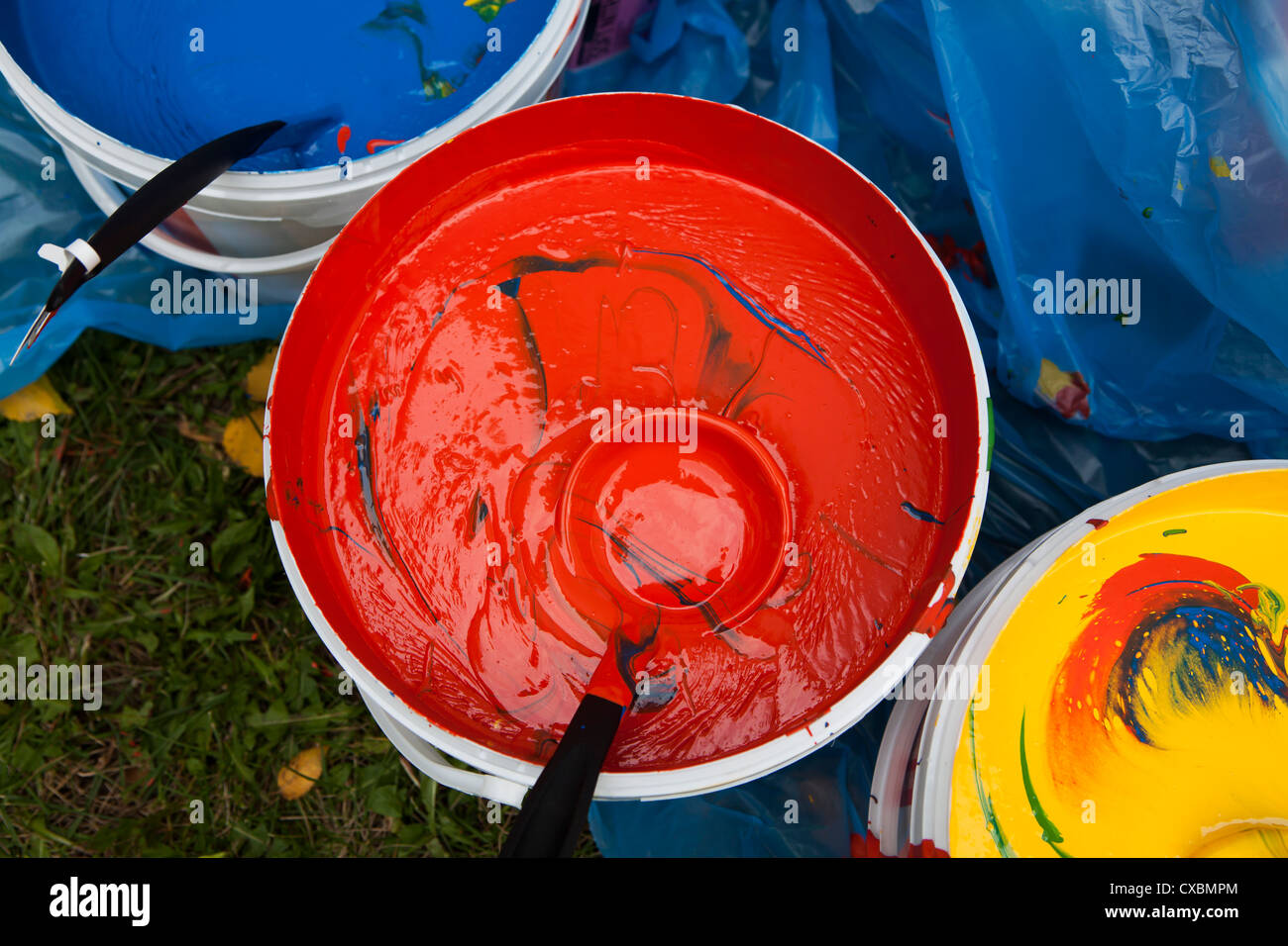 Paint buckets with colors stains Stock Photo Alamy
