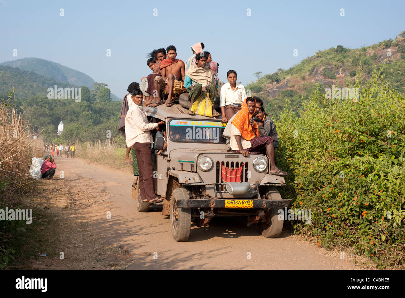 Stock photo of Typical rural transport, overloaded van with people,  Maharashtra, India. Available for sale on