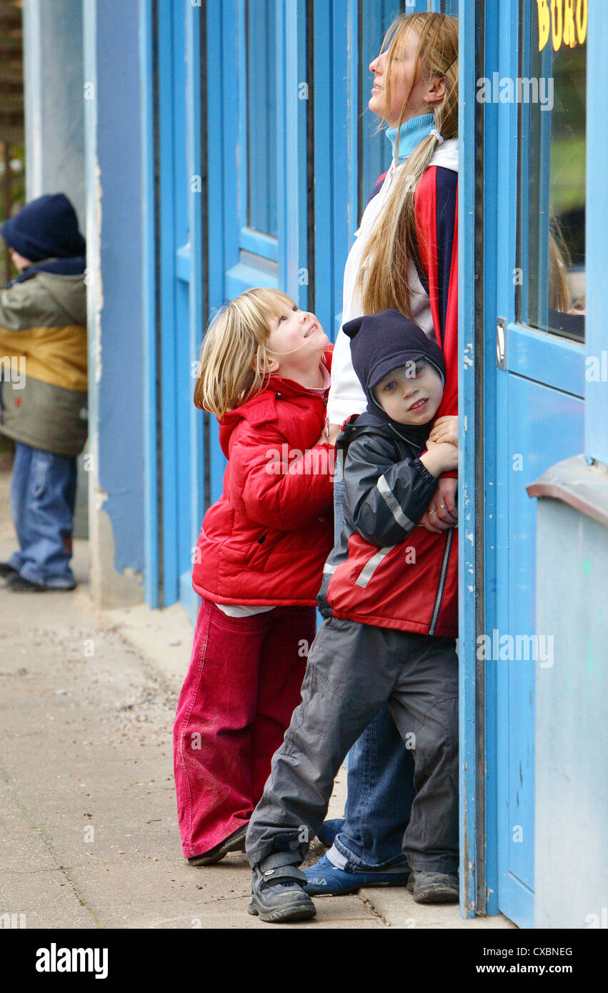 Berlin, children play with a teacher Stock Photo