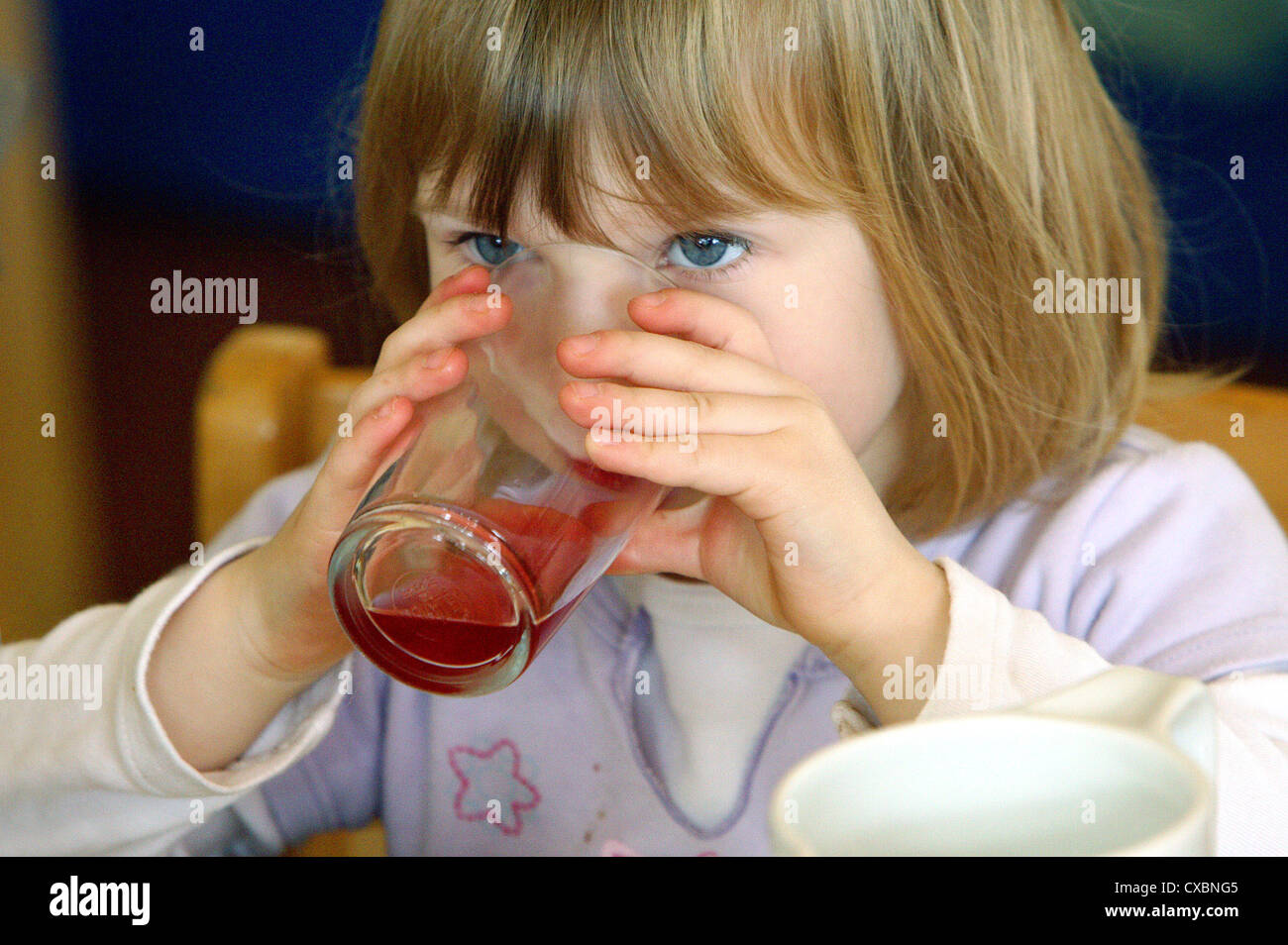 Berlin, girls drink thoughtfully from their drinking glass Stock Photo