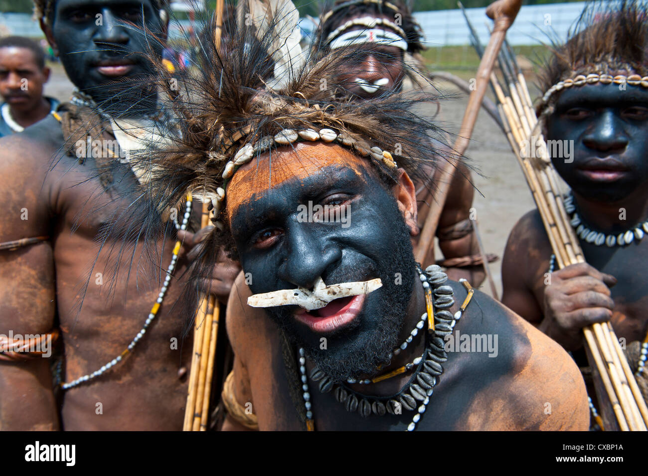 Colourfully dressed and face painted local tribes celebrating the traditional Sing Sing in the Highlands of Papua New Guinea Stock Photo