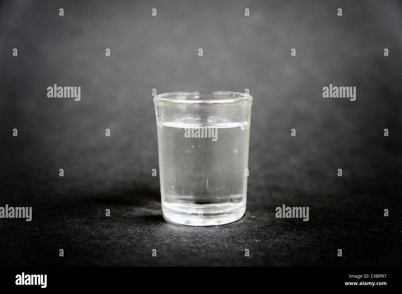 unidentifiable alcohol unknown shot tumbler jigger illustrative image