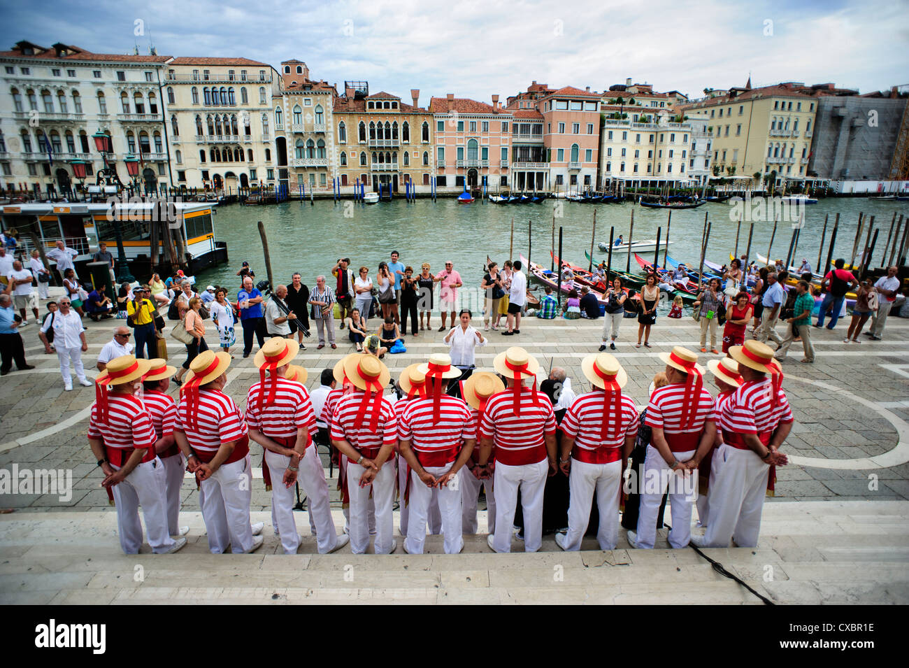 Members of the 'Coro della Serenissima' at the blessing of historic Regatta, Venice, Italy. Stock Photo