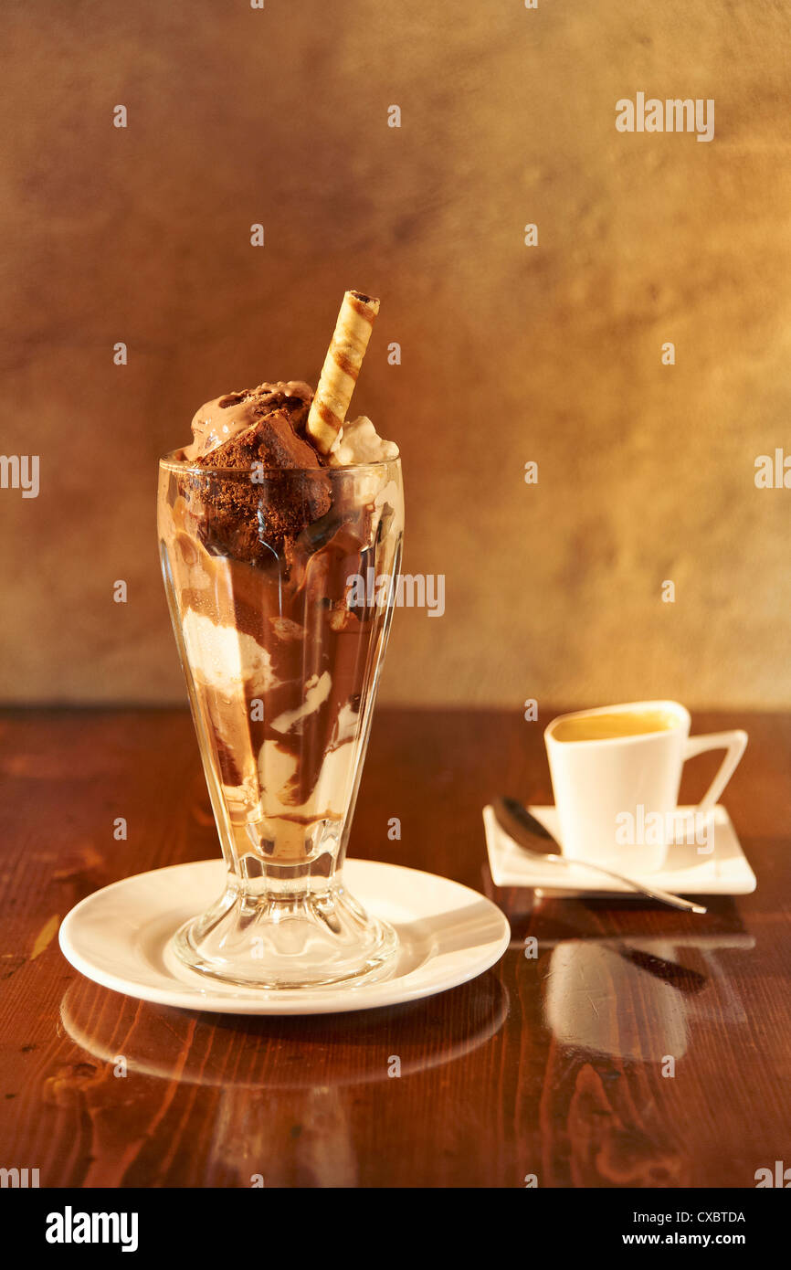 A still life shot of a chocolate sundae and a cup of espresso Stock