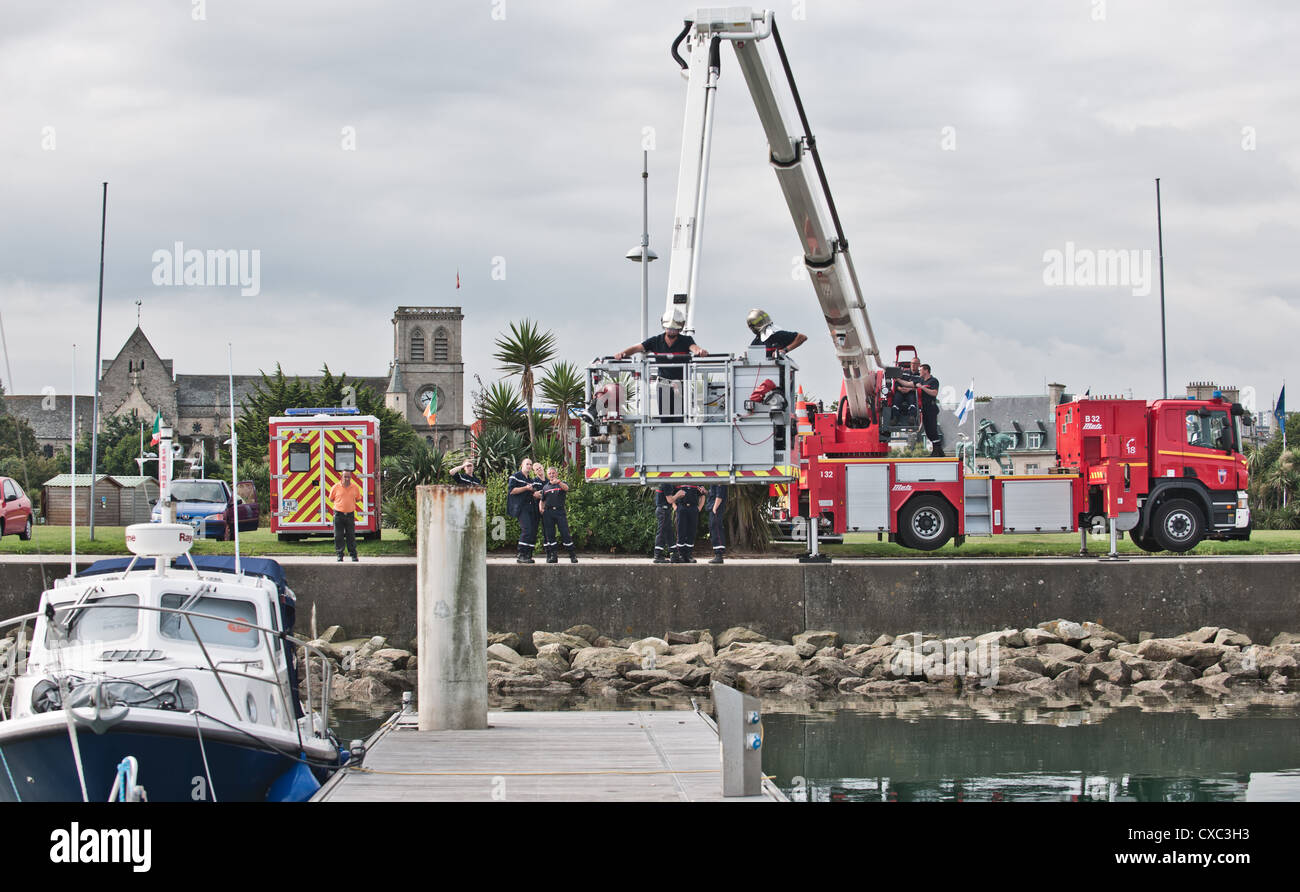 A fireman exercise taking place at a port in Cherbourg in Northern France. Stock Photo