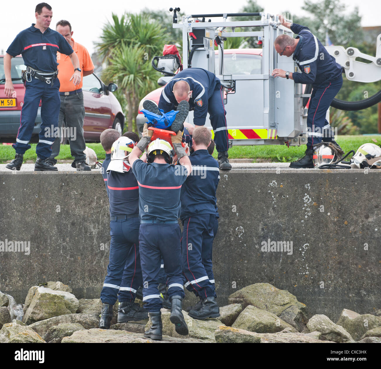 A further scene of the Sapeurs Pompiers performing a training exercise at the Marina Port in Cherbourg, Northern France. Stock Photo