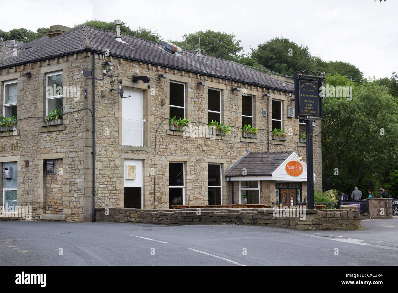 The converted 19th century riverside cotton mill which is the Waterside restaurant at Summerseat, Bury, Lancashire, since destroyed by flood waters.. Stock Photo
