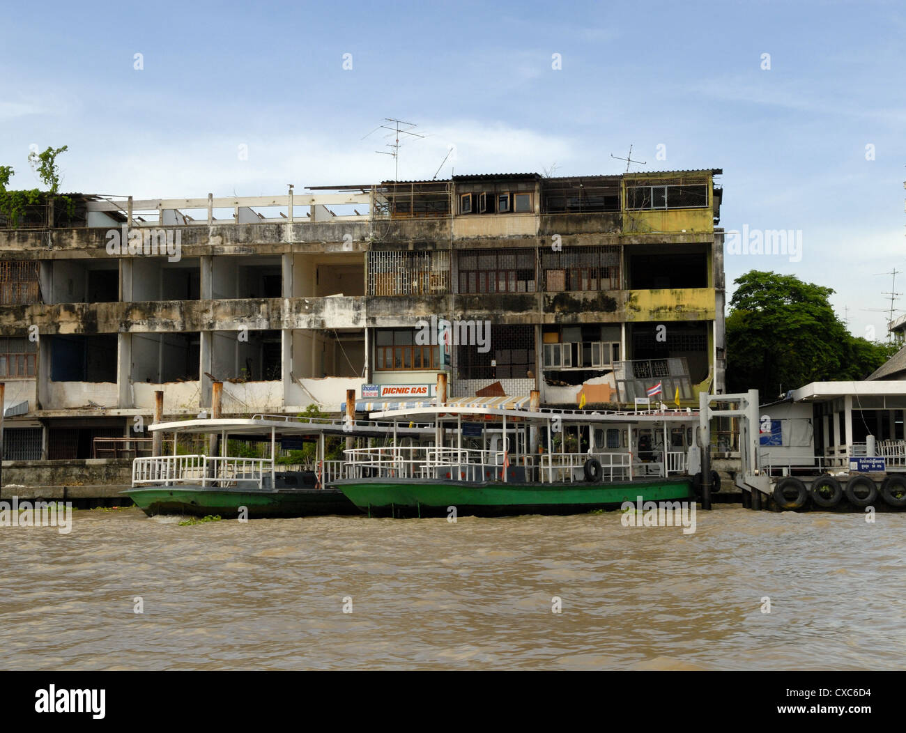 Buildings on banks of Chao Phraya River, Bangkok, Thailand Stock Photo