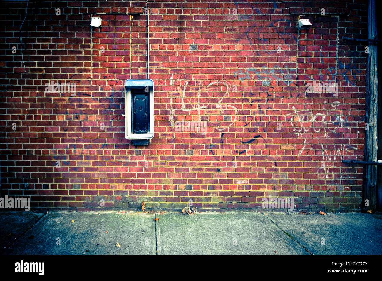 Grungy Urban Brick Wall With Obsolete Out Of Use Payphone Good For Backdrop Stock Photo Alamy