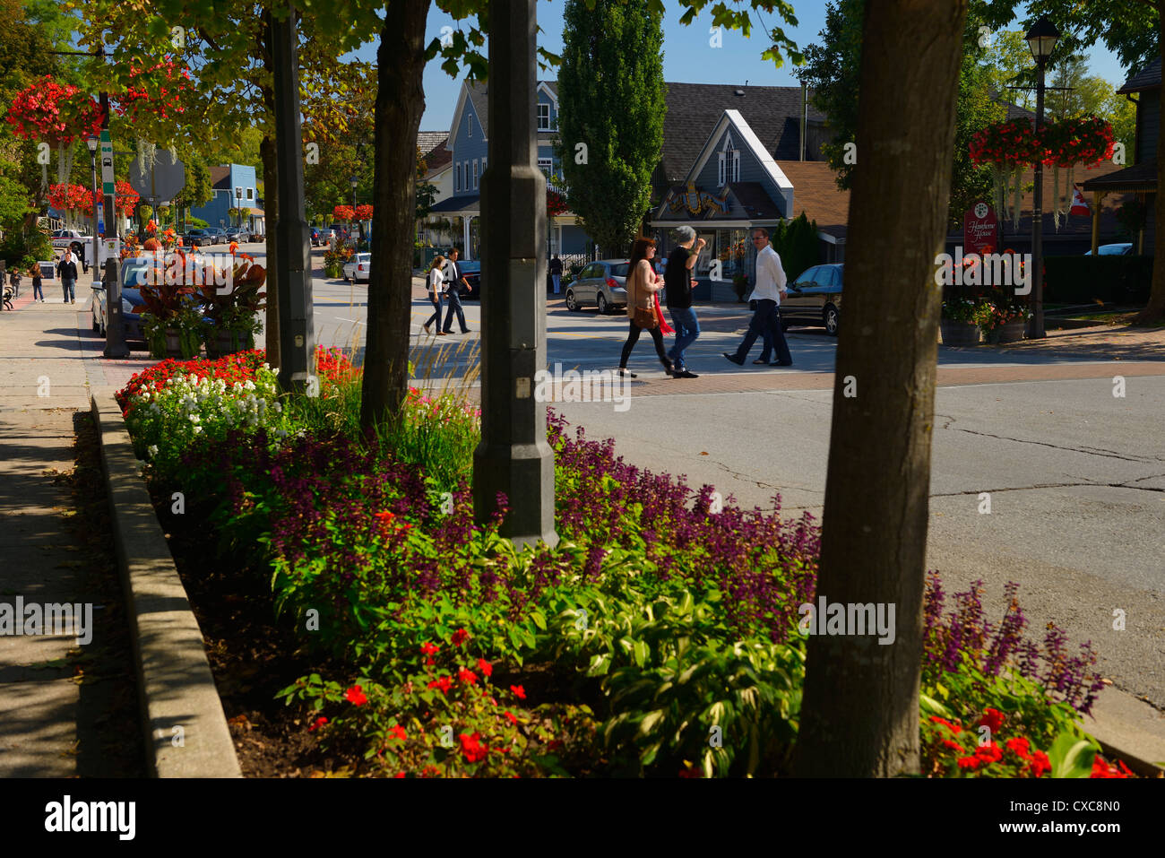 Pedestrians crossing Islington Avenue in Keinburg village in Vaughan Ontario Canada Stock Photo