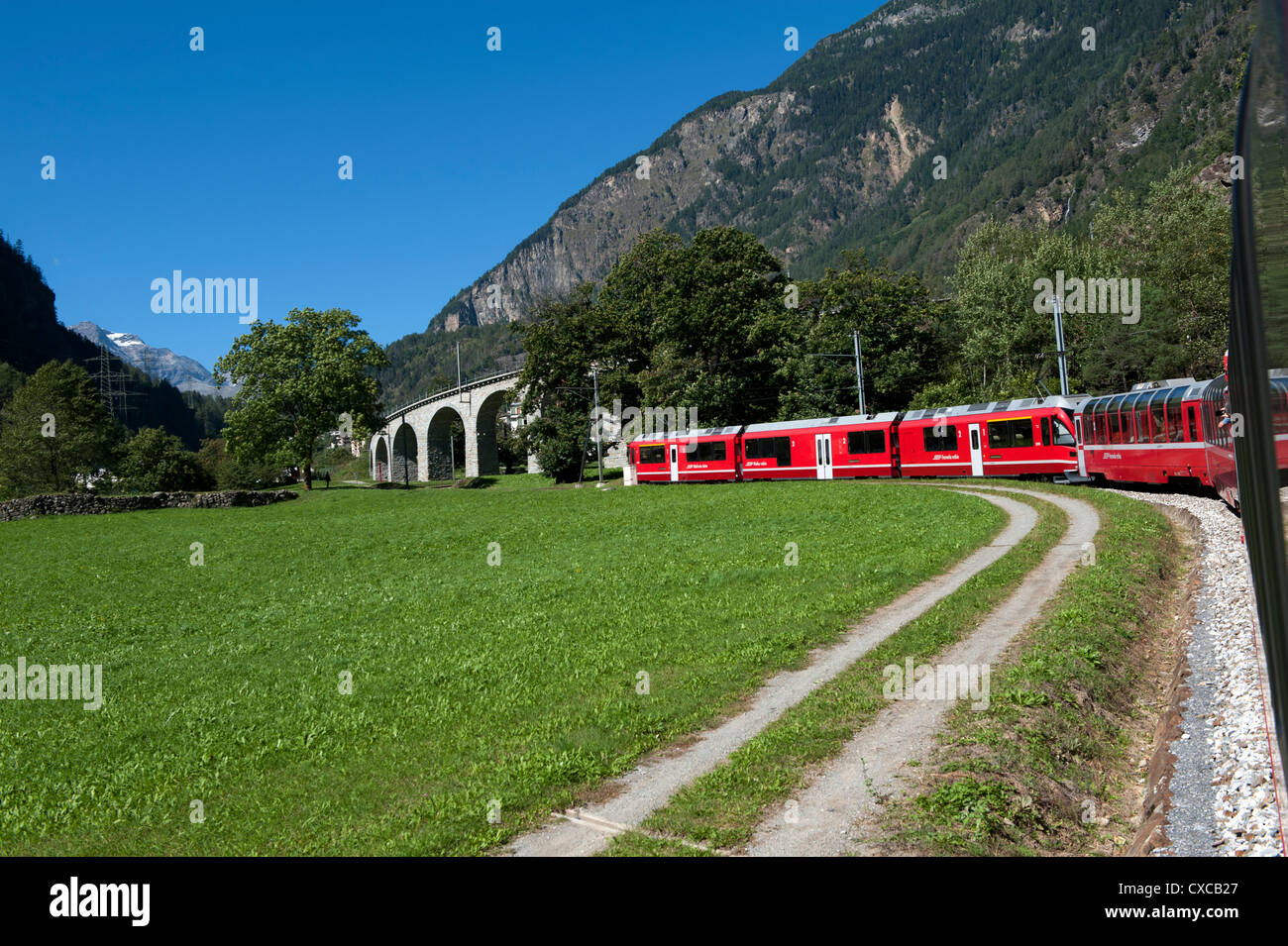 Switzerland. Bernina Express passing through and over the circular