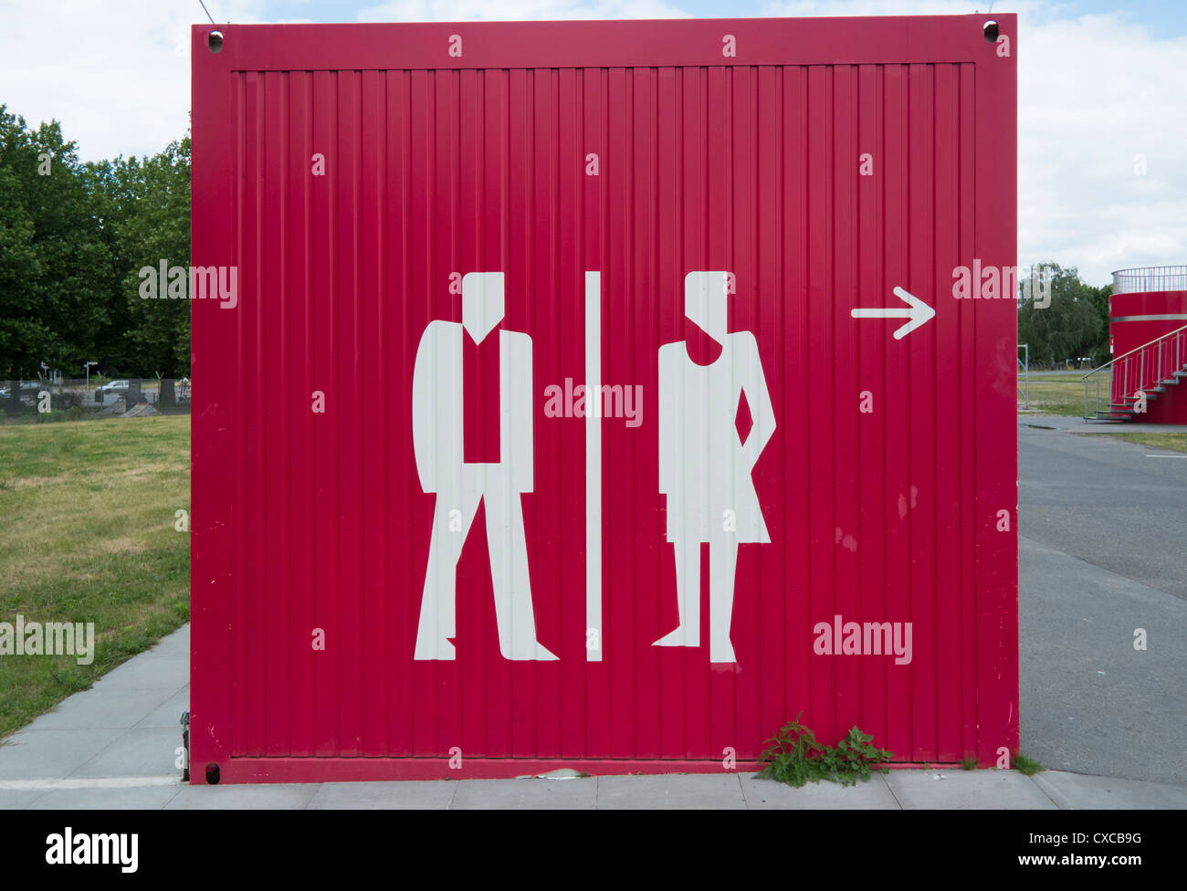 Signs for public toilets on outdoor toilet block Stock Photo