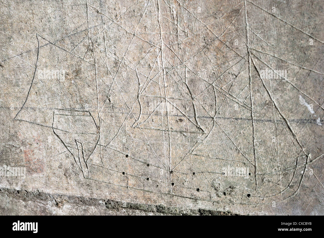 Old graffiti of galleon sailing ship carved on rampart wall of the citadel at Brouage / Hiers-Brouage, Charente-Maritime, France Stock Photo