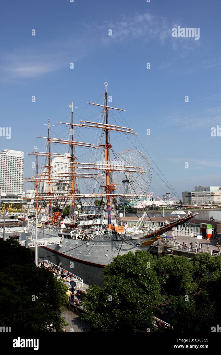 View of Nippon Maru, sailing ship in dock in Yokohama, with blue sky and green trees Stock Photo