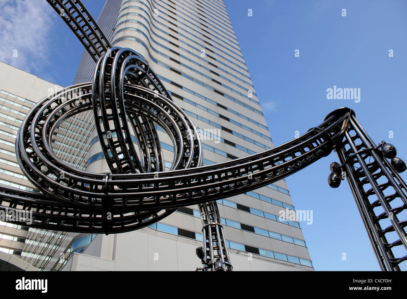 Upward view of sculpture in Queens Square, Yokohama Japan with Landmark
