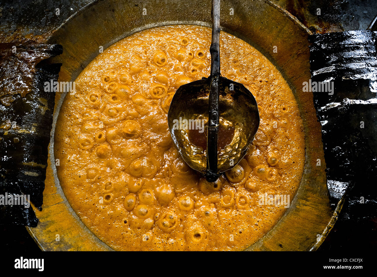 A boiling sugar cane juice seen during the processing of panela in a