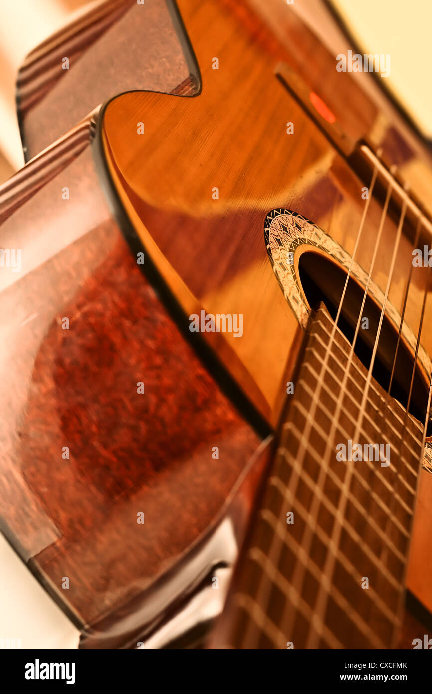 Polished surface of the body acoustic guitar with a neck and strings Stock Photo