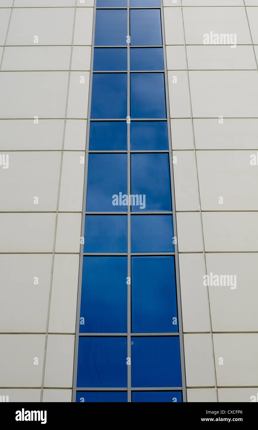 Blue sky reflected in the windows of office building Stock Photo - Alamy