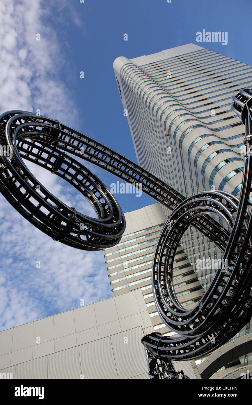 Upward view of sculpture in Queens Square, Yokohama Japan with Landmark