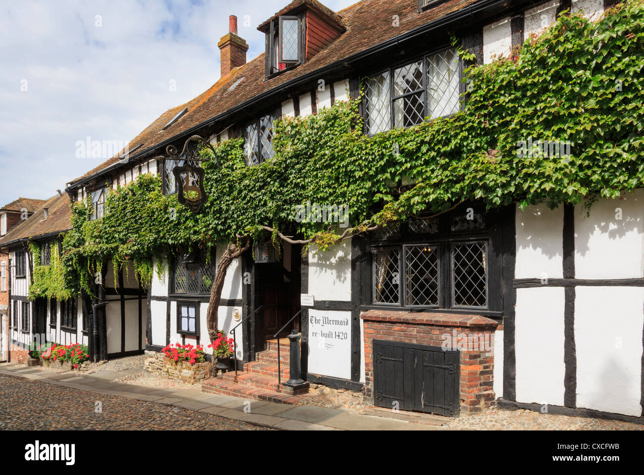 15th century haunted timbered Mermaid Inn on quaint cobbled street in historic Cinque Port town of Rye Sussex England UK Britain Stock Photo
