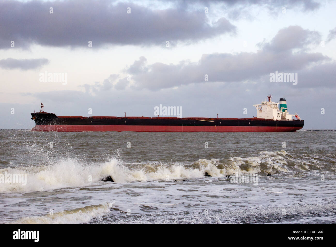 Large oil tanker leaving the port of Rotterdam, The Netherlands Stock Photo