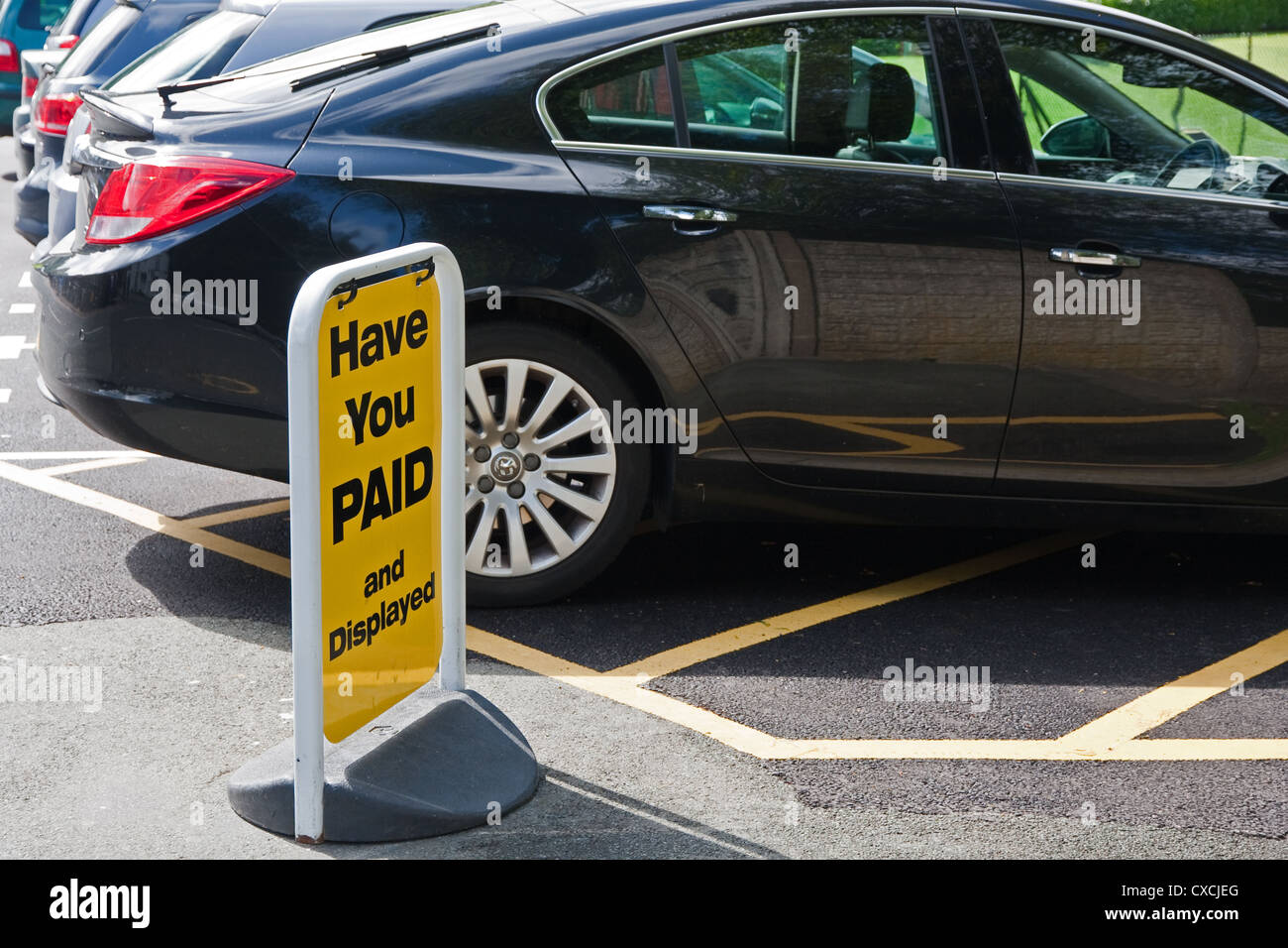 Payment reminder sign in car park Stock Photo