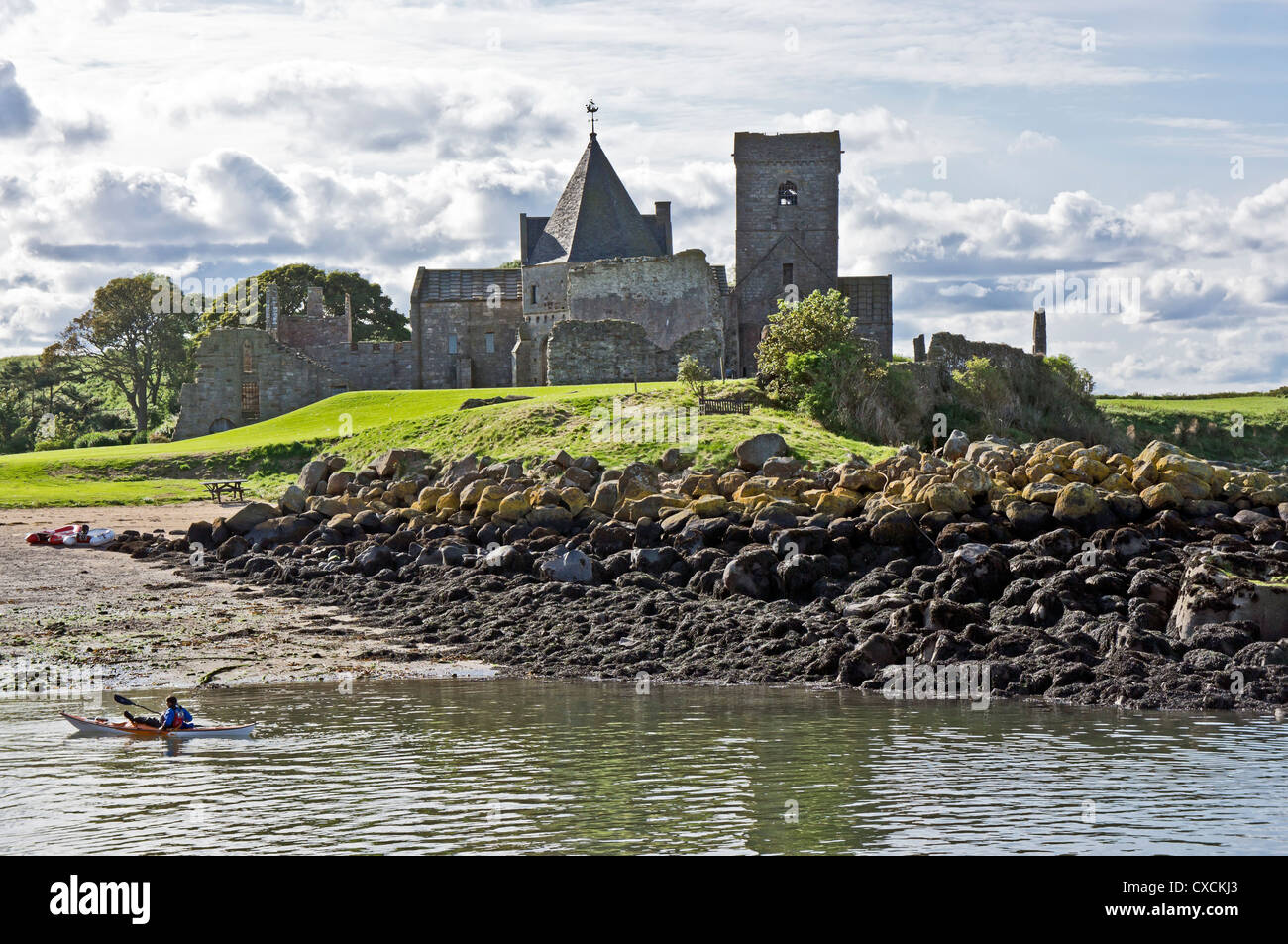 St Colm's Abbey on the small island Inchcolm in the Firth of Forth opposite Edinburgh in Scotland as seen from the pier. Stock Photo