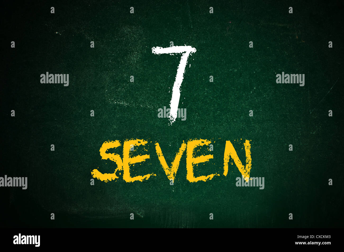 Number seven, handwritten number seven with a chalk on a green ...